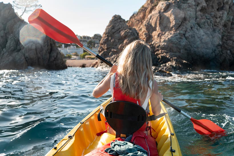 young-beautiful-woman-traveling-by-canoe